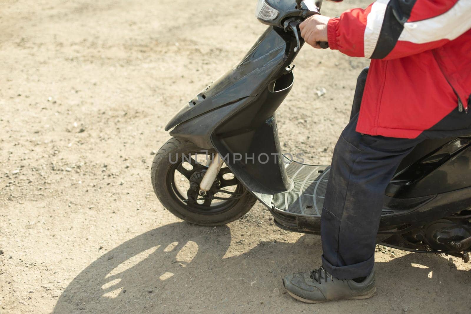 Moped on street. Man on scooter. Easy transport. by OlegKopyov