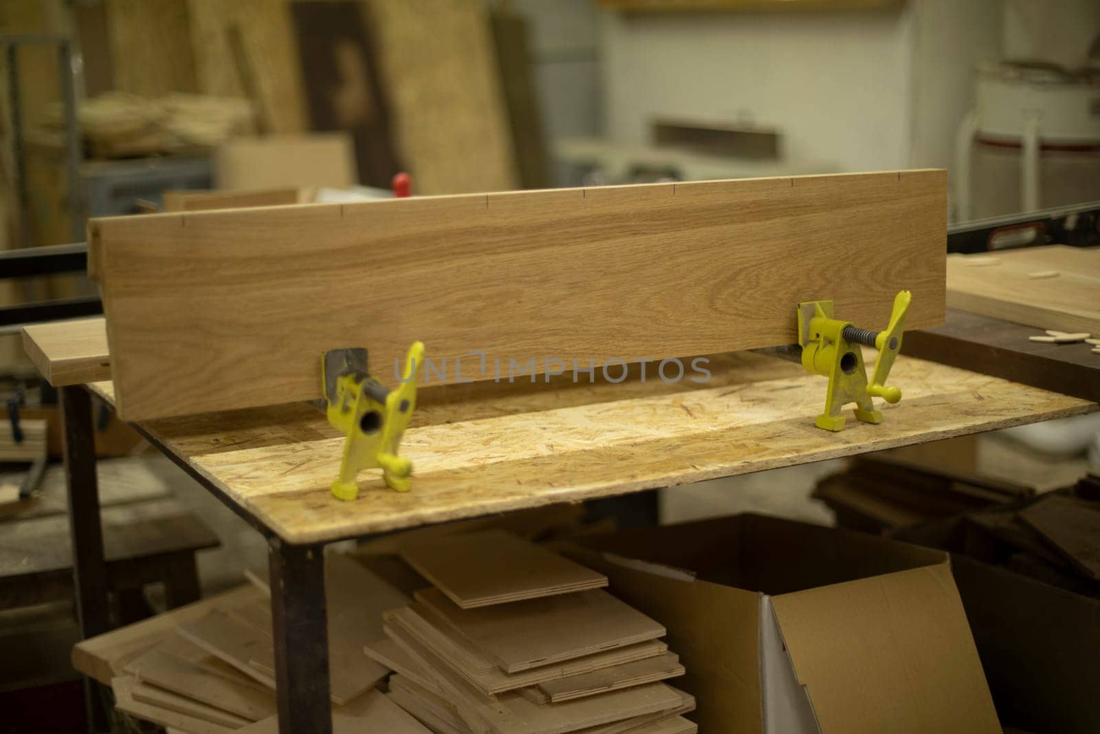 Workbench for boards. Table in carpentry workshop. Carpenter's workplace. Creation of furniture.