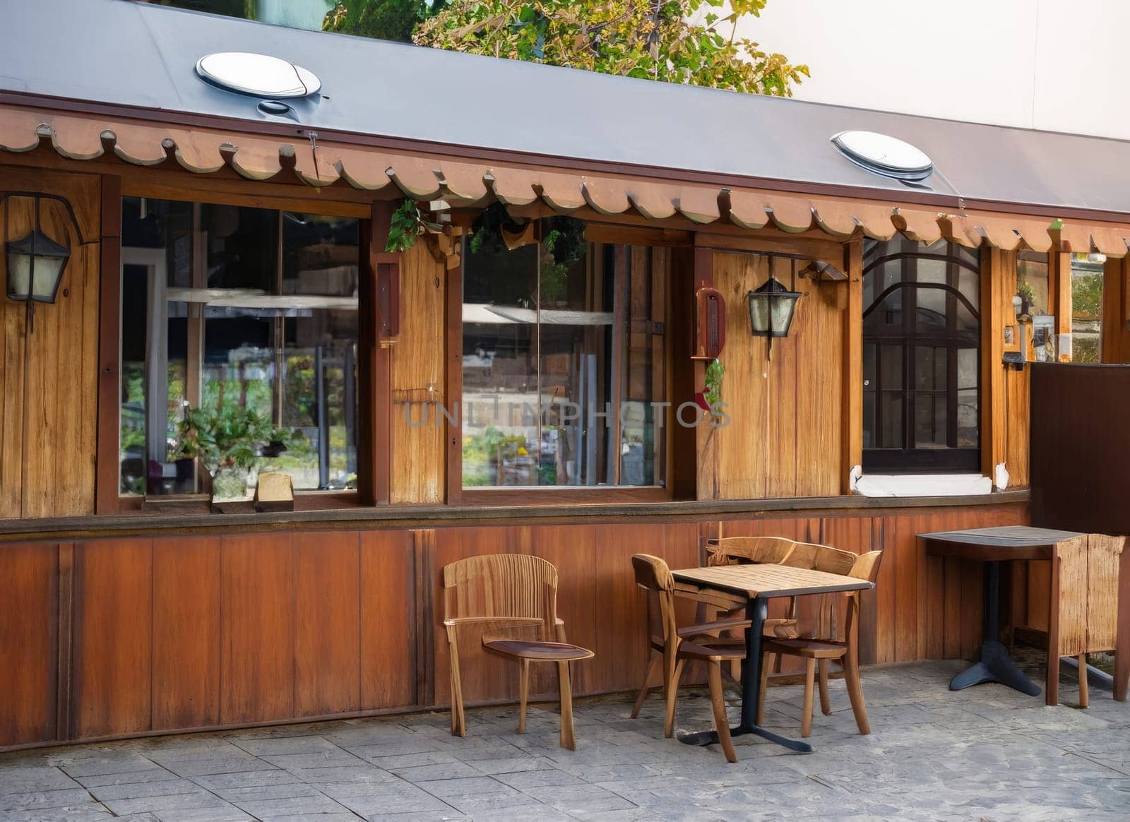 Exterior of small European wooden cafe or restaurant. with copy space.