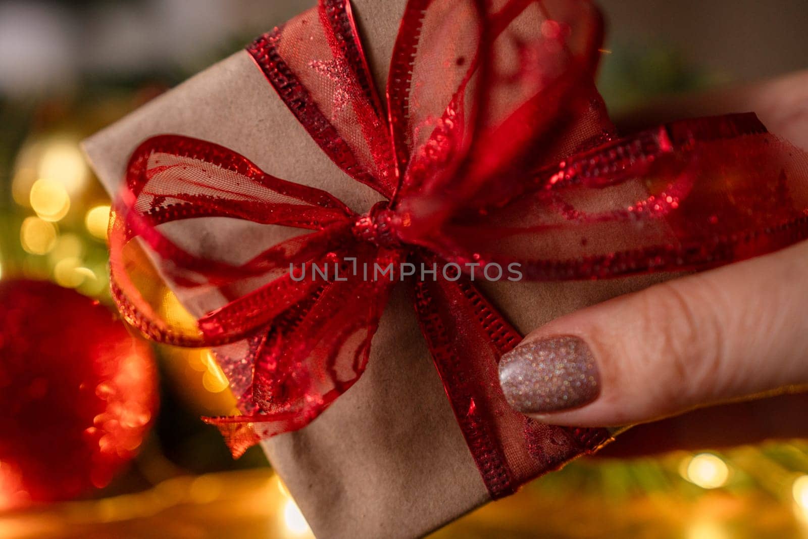 Christmas gift or present box, against magic bokeh background. Beautiful Christmas gift boxes with ribbon by Matiunina