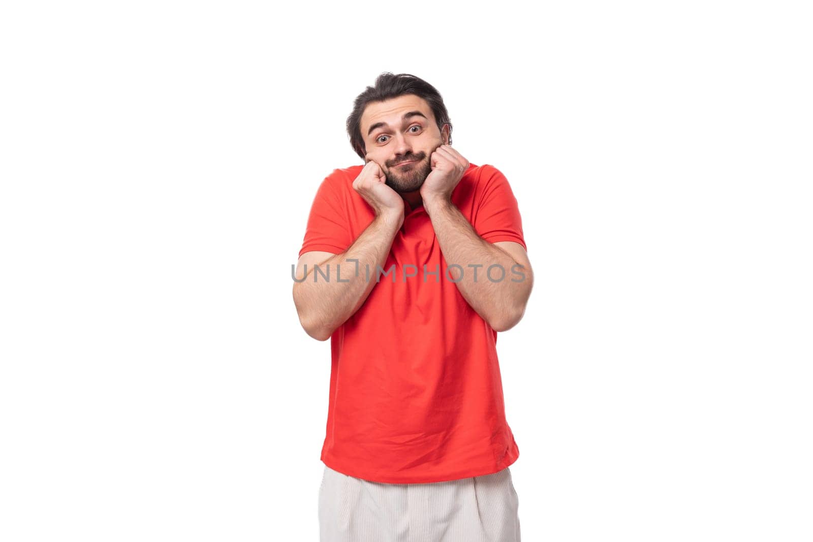 young confused man with black hair and beard dressed in a red corporate t-shirt by TRMK