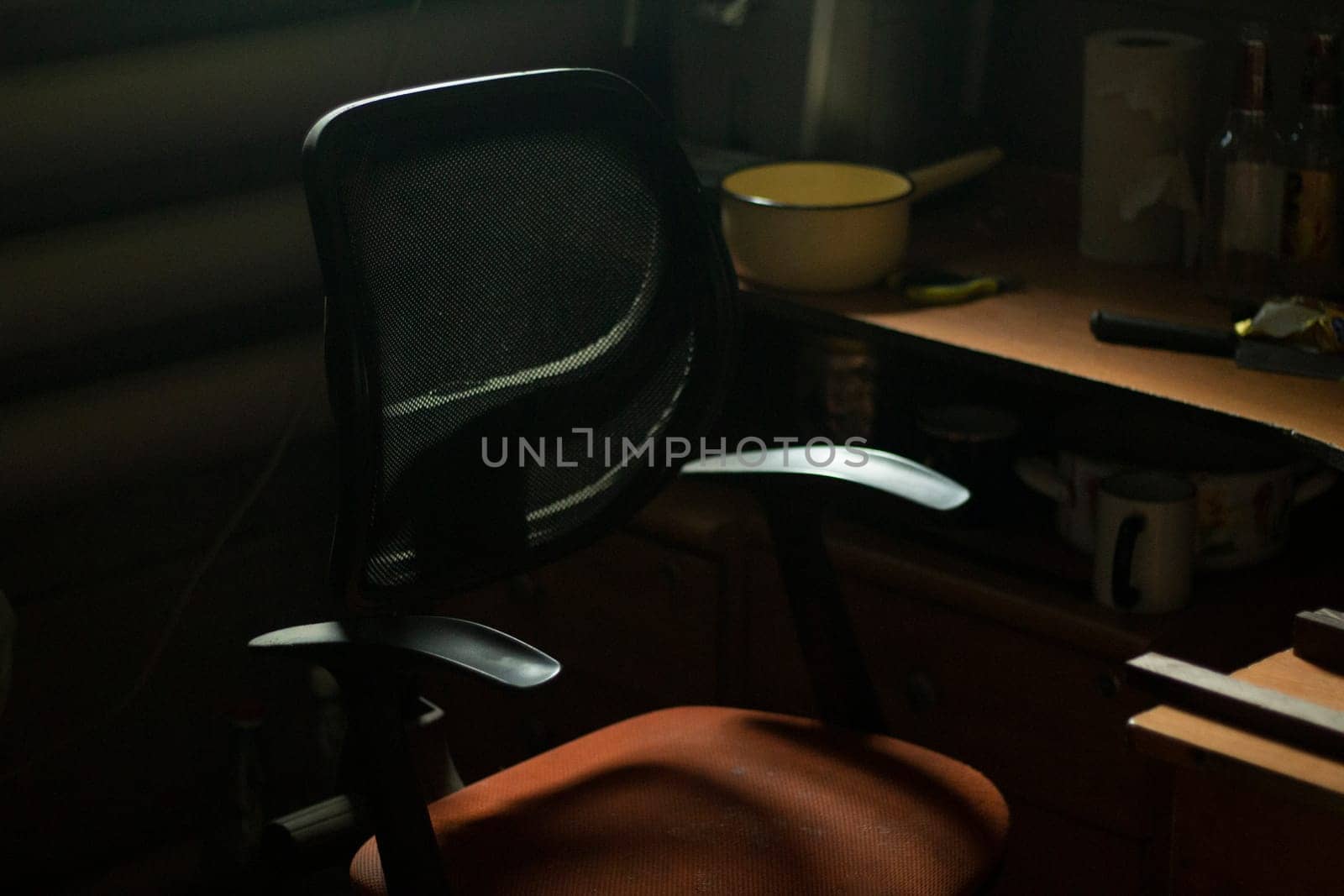 Chair in room. Computer chair. Dim light indoors. by OlegKopyov