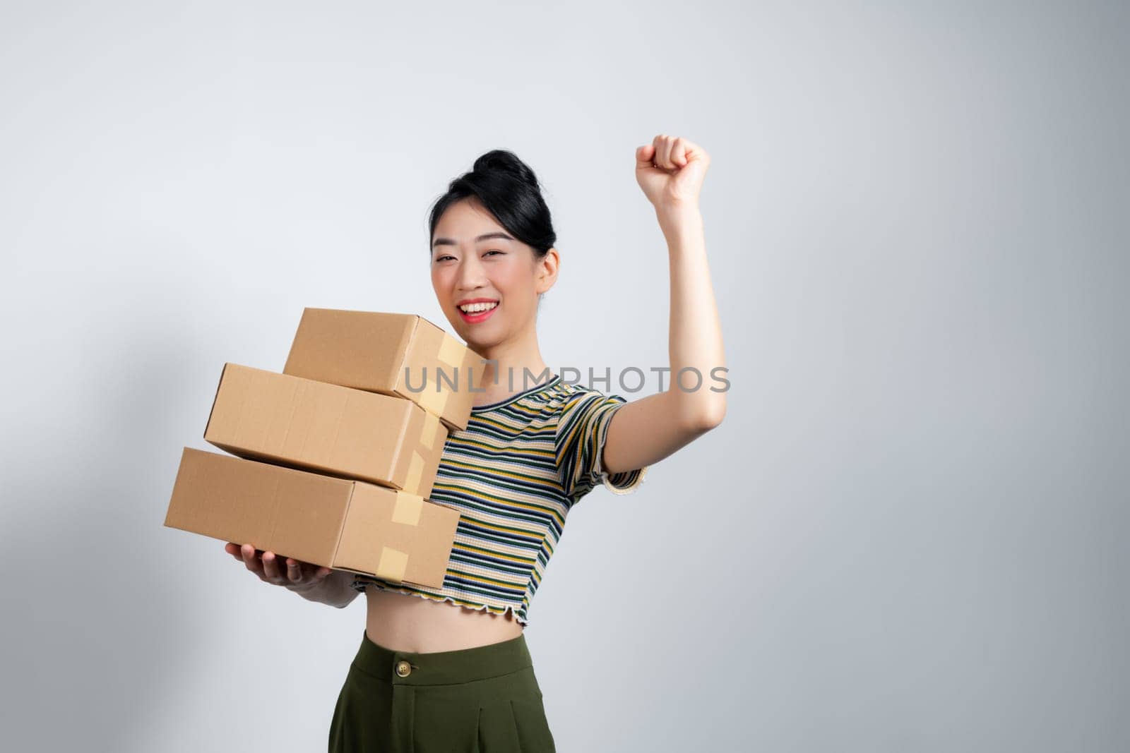 Young asian woman working at small business ecommerce celebrating success excited.