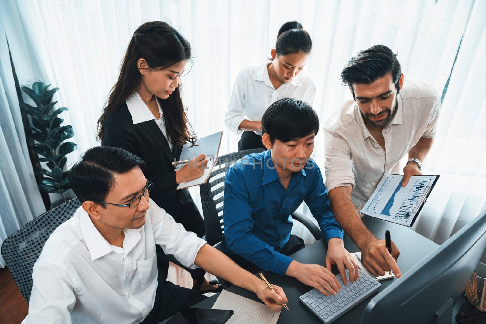 Group of diverse office worker employee working together on strategic business marketing planning in corporate office room. Positive teamwork in business workplace concept. Prudent