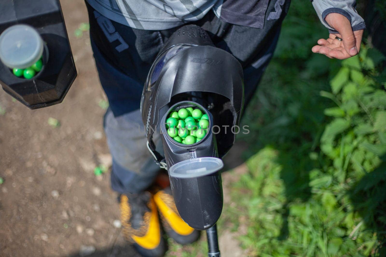 Balls with paint in jar. Sports equipment. Preparation for tactical shooting at target.