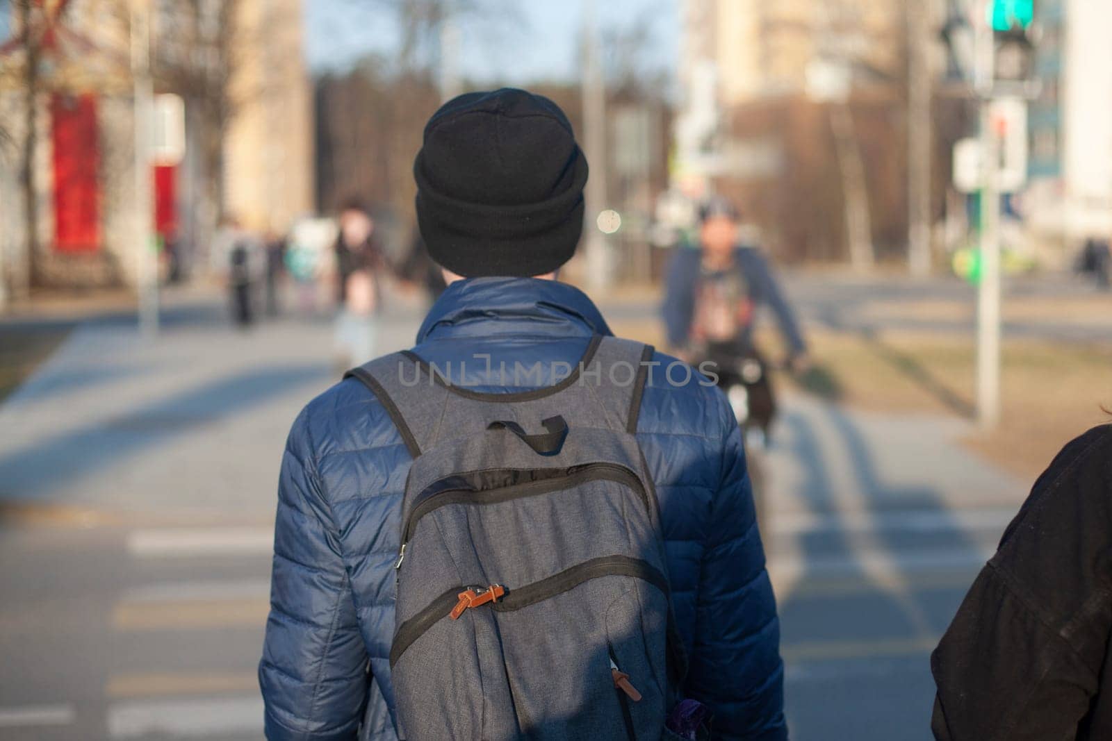 A guy with a backpack from the back. A man with a hat and a backpack. by OlegKopyov