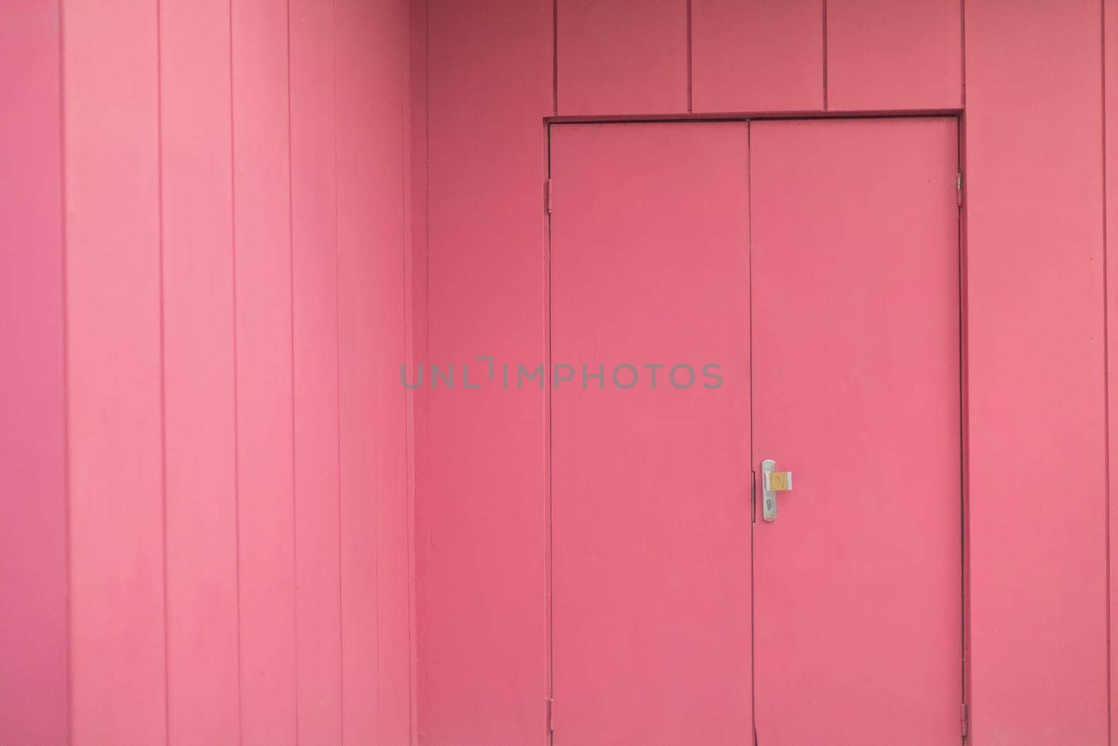 Pink interior. Door to hall. Painted walls. One color of walls.