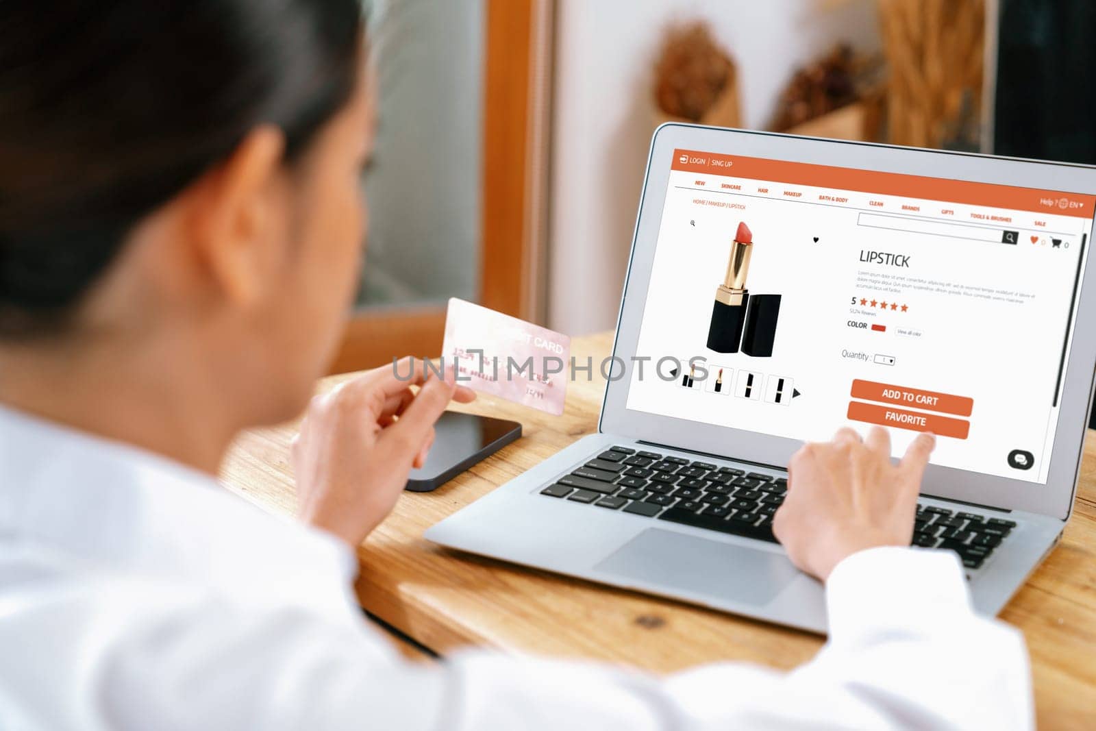 Woman shopping online on internet marketplace browsing for sale items for modern lifestyle and use credit card for online payment from wallet protected by uttermost cyber security software