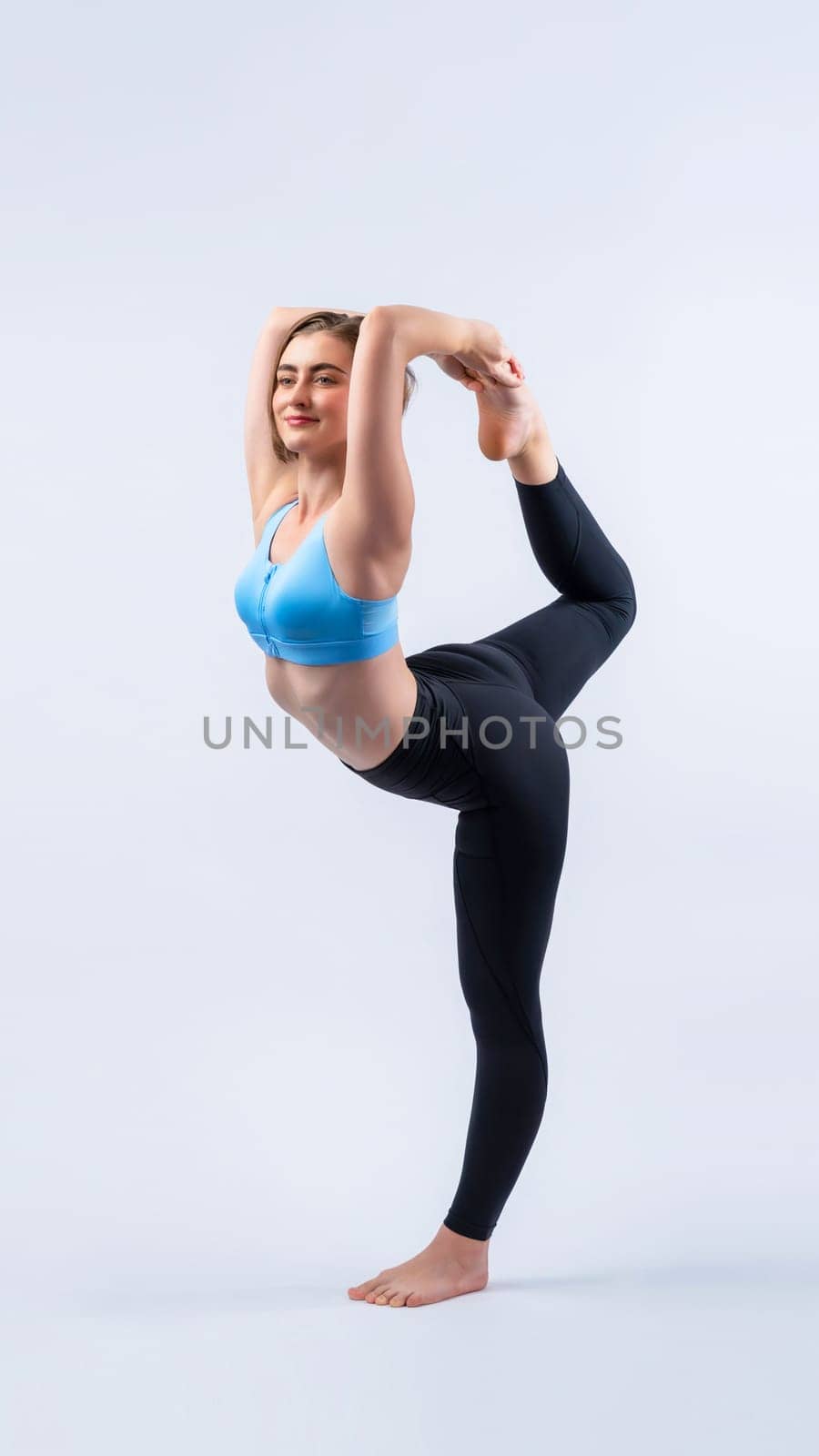 Full body length gaiety shot athletic and sporty woman doing healthy and meditative yoga exercise workout posture on isolated background. Healthy active and body care lifestyle