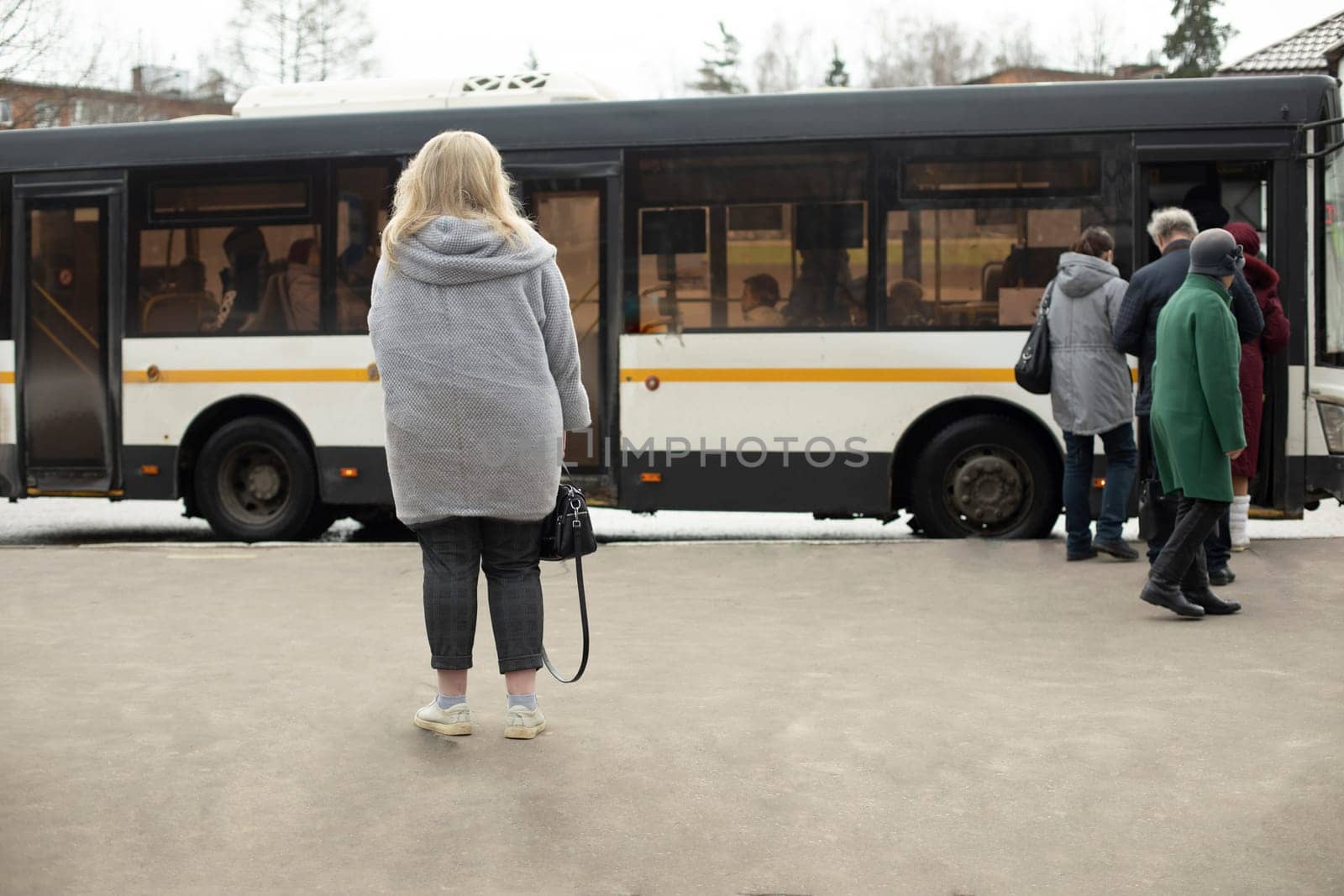 People are waiting for bus. Russians at bus stop. by OlegKopyov