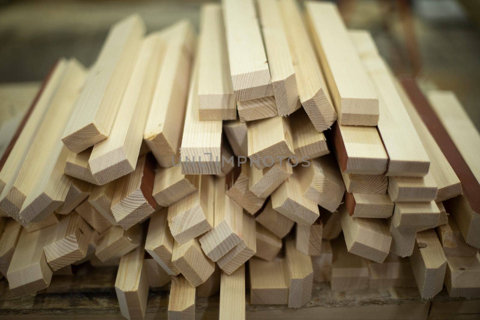 Details made of wood. Plaques on table. Building material in carpentry workshop.