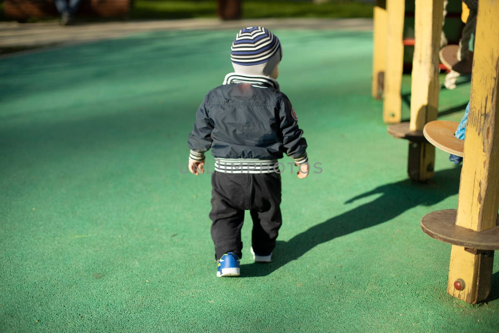 Child on playground. Small walks outside. Walk with child. Preschooler alone.