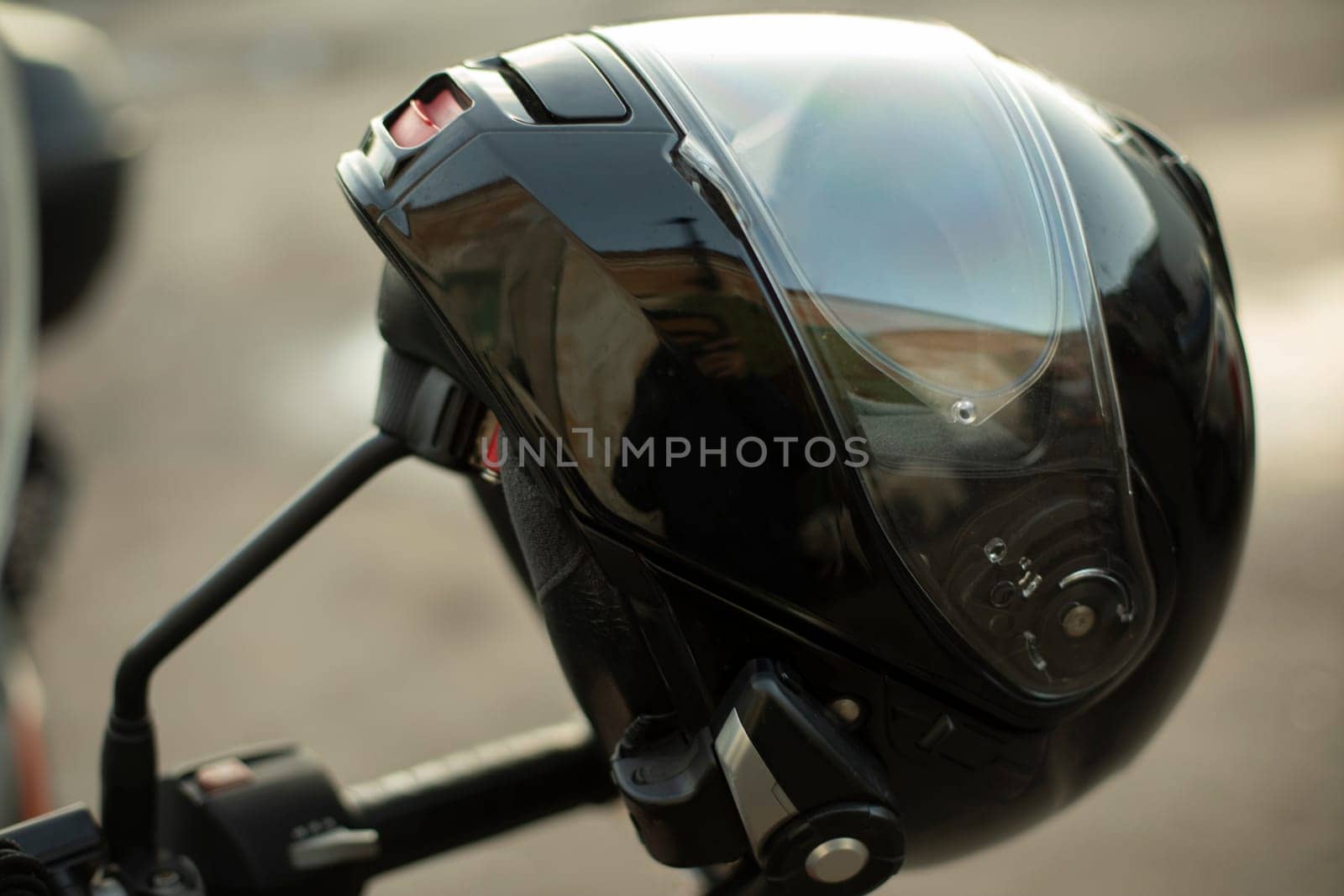 Motorcyclist helmet. Black helmet on motorcycle. Security tool. by OlegKopyov