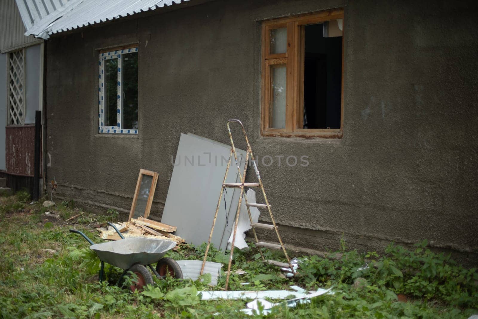 Old house. Abandoned building. House without windows. Broken glass. Repair details.