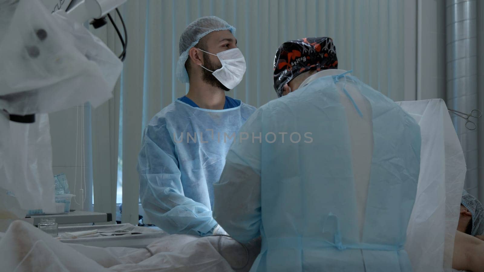 Medical workers performing surgery on a patient under anesthesia. Action. Concept of health care and medicine