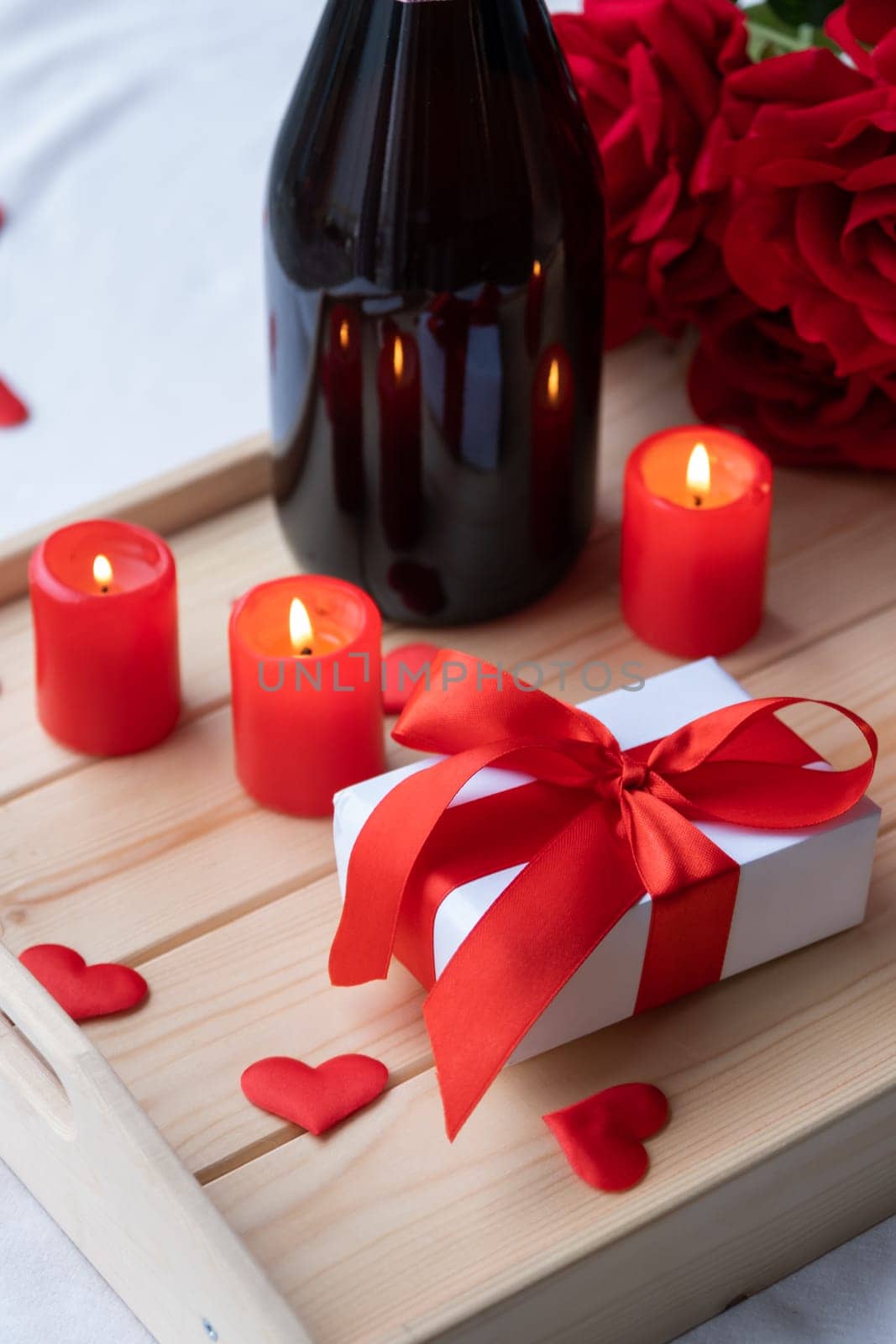 valentine gift box and candles in wooden tray by Desperada