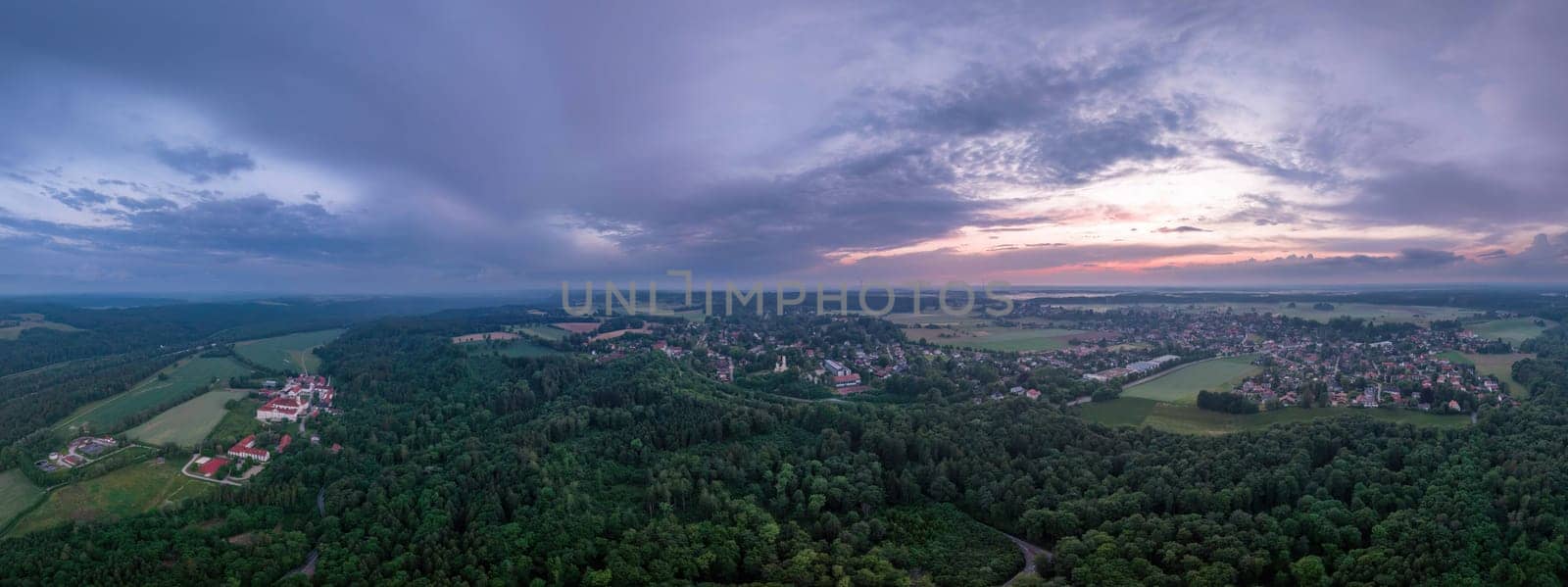 Dusk Over Schaeftlarn: Aerial View of Village and Fields by AllesSuper