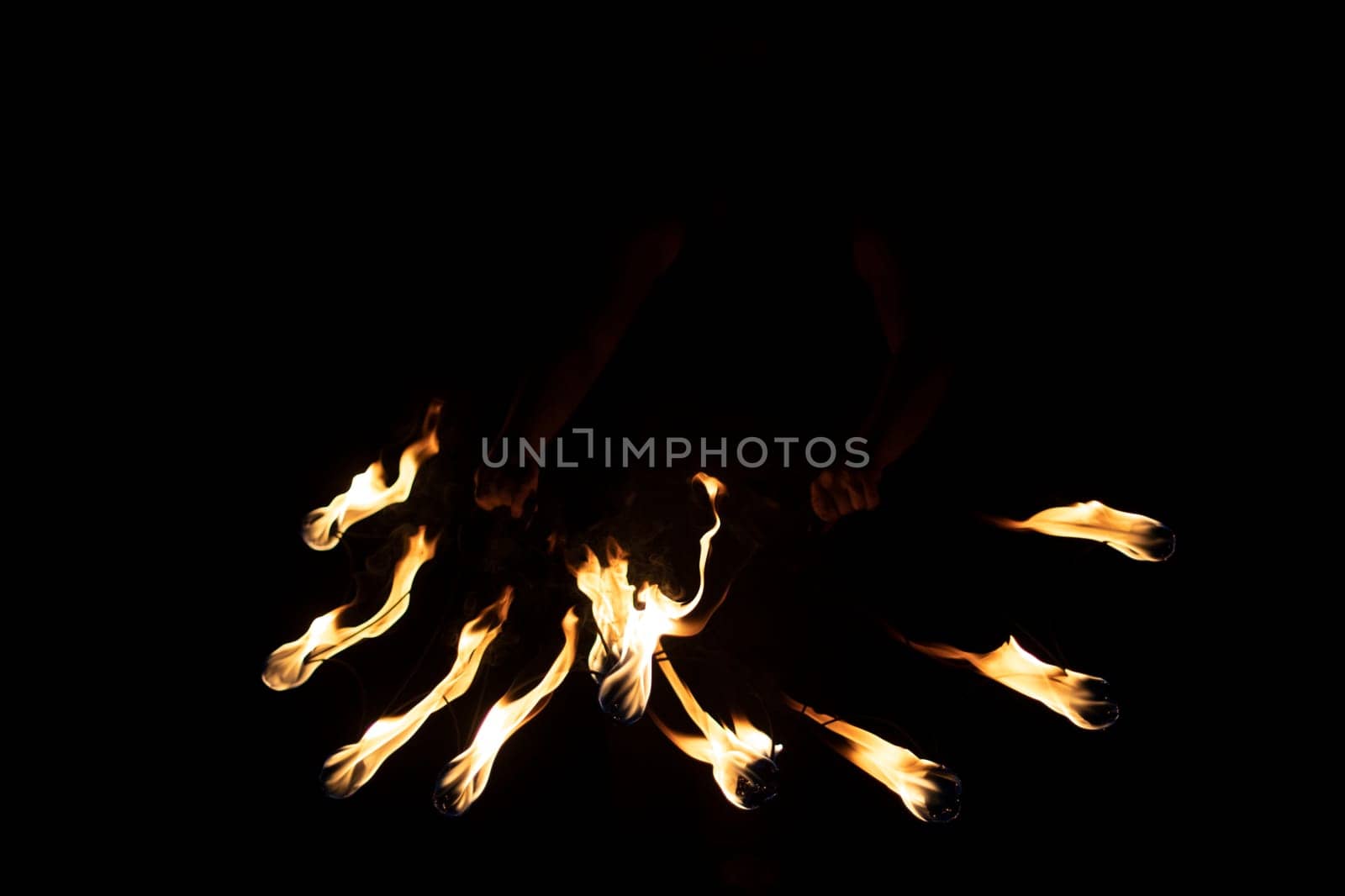 Lights in dark. Burning flames at night. Texture of burning fuel. Details of fire show.