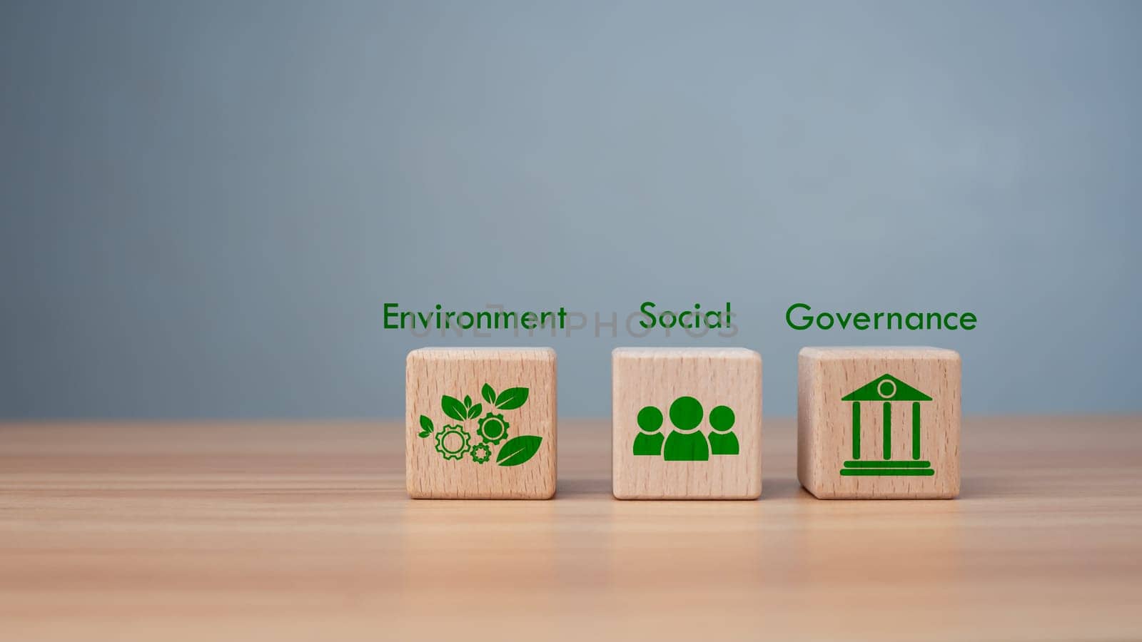 ESG concept of environmental, social and governance, wood block and icon on wooden background It is an idea for sustainable organizational development ​account the green environment.