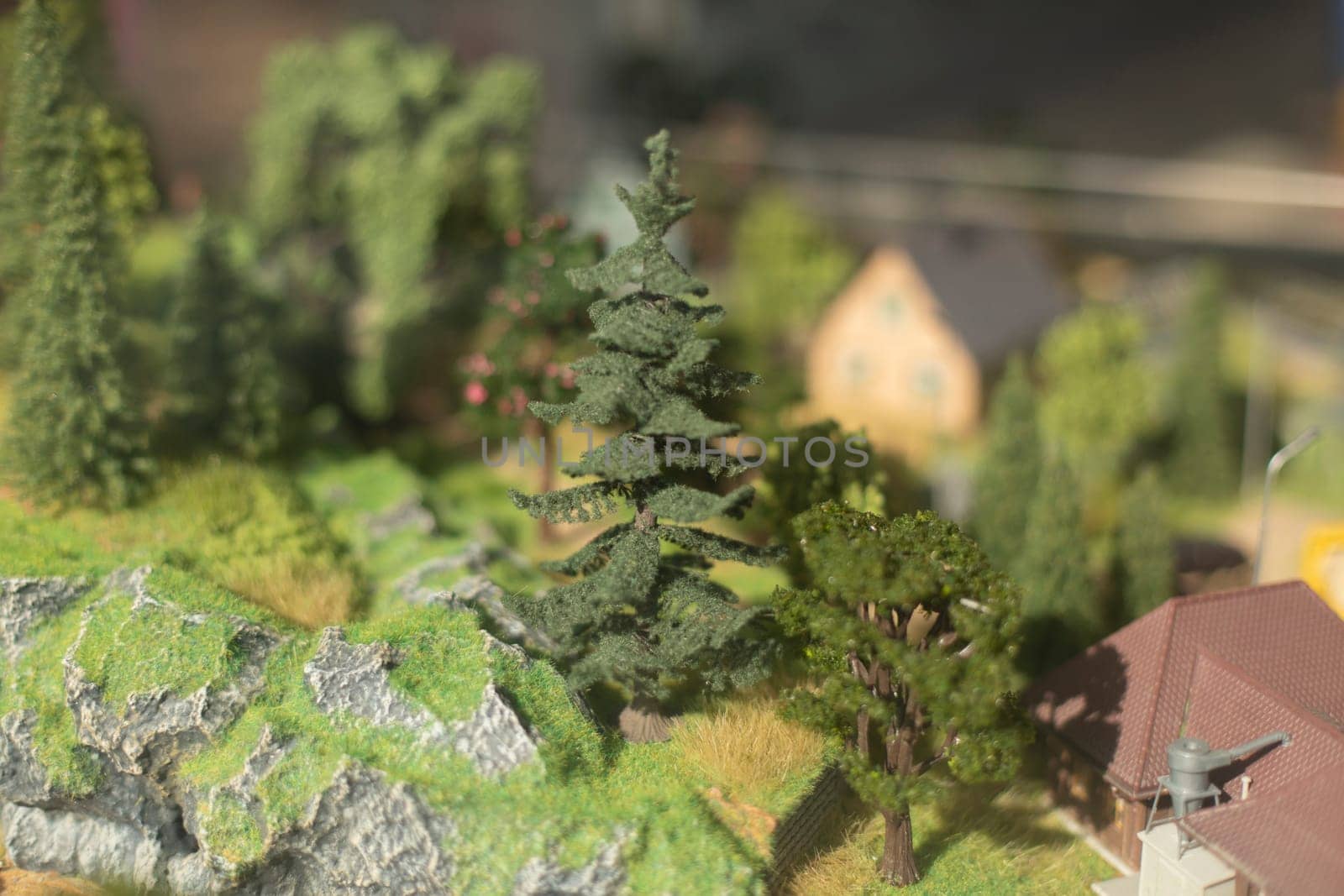 Town in mountains in miniature. Trees made of plastic. by OlegKopyov