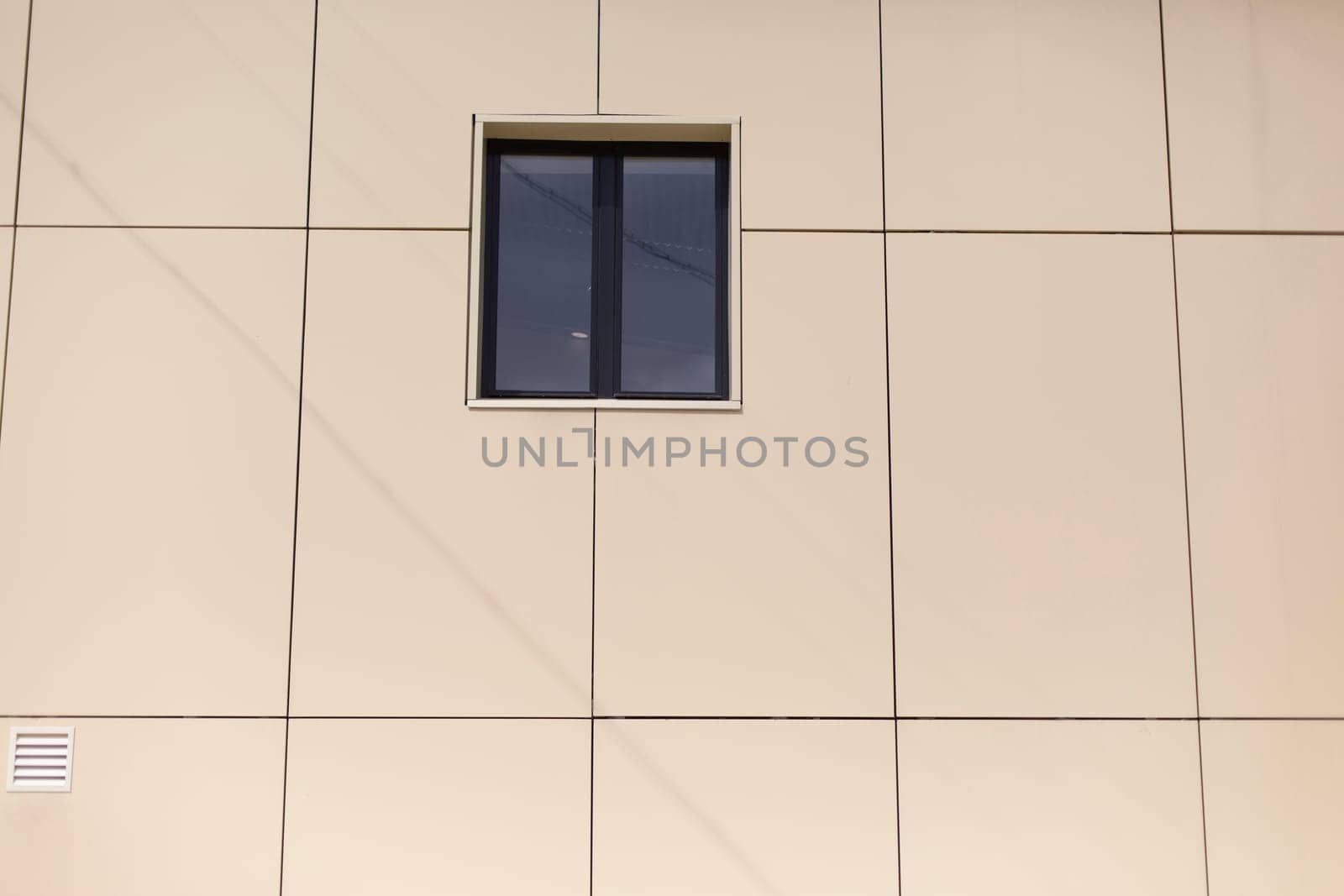 Window in wall of building. Architecture details. Facade of house. Minimalism in design.