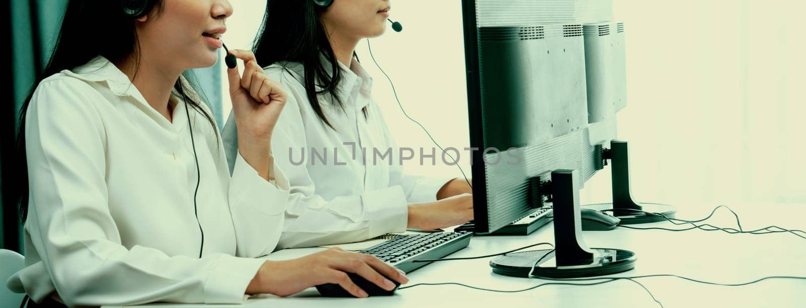 Call center wearing headset working in office for customer support oratory by biancoblue