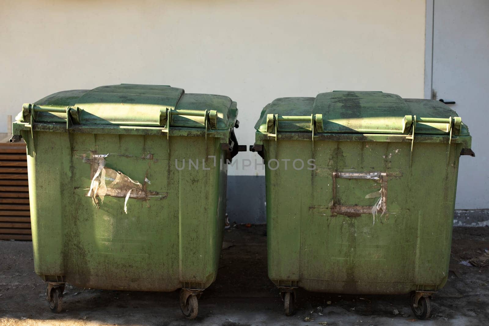 Green garbage cans. Containers for waste on street. by OlegKopyov