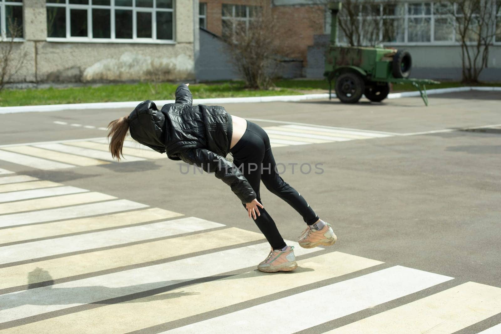 Child falls on asphalt. Beginning of fall. by OlegKopyov