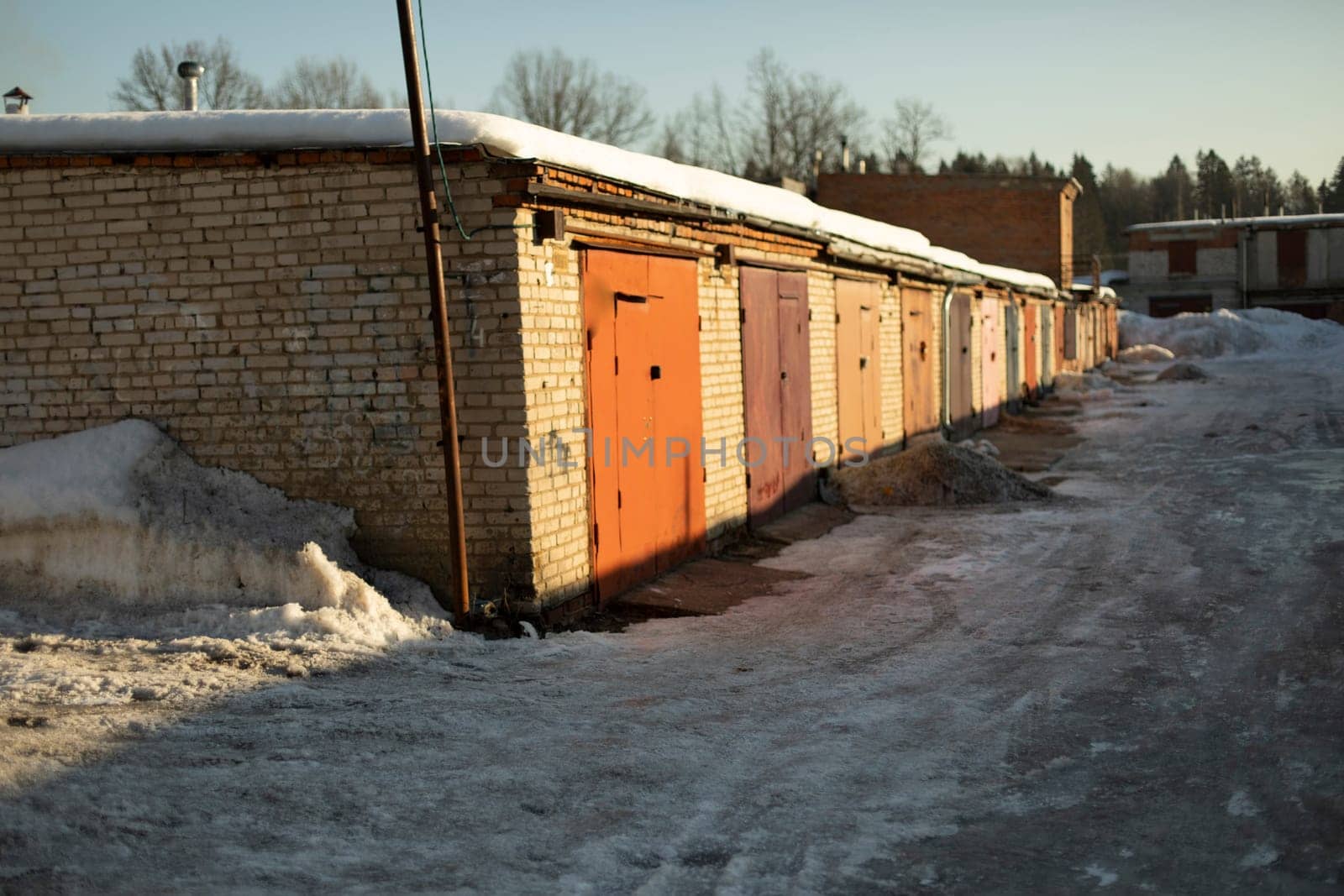 Garages in Russia. One-storey brick building. Travel in winter.