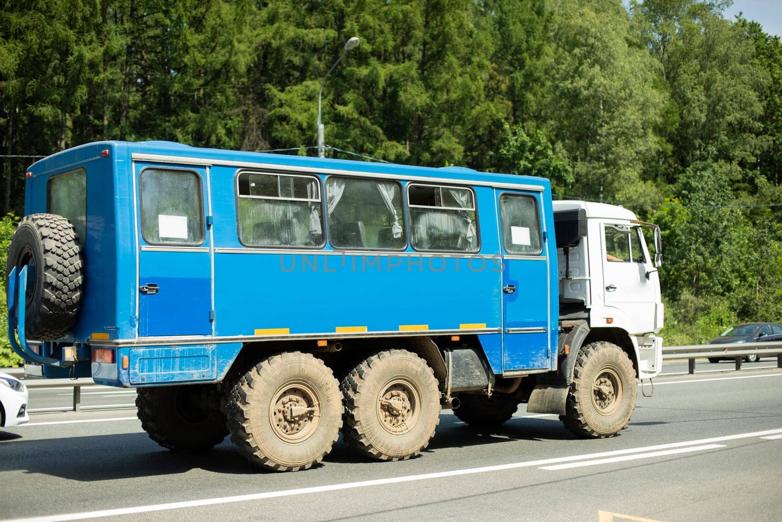 Truck on road. Car is driving on track. Transport with trailer. Shipping.