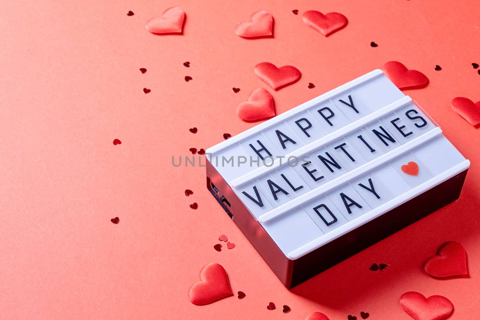 letter board with words Happy Valentines Day on red background by Desperada