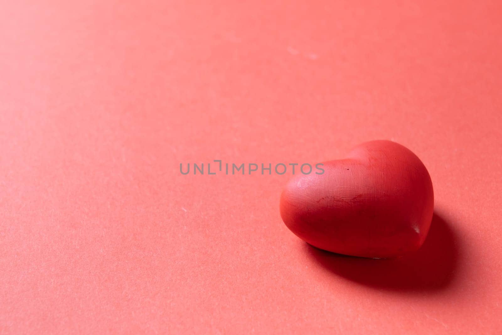 Valentines day. Red heart with copy space isolated on red background