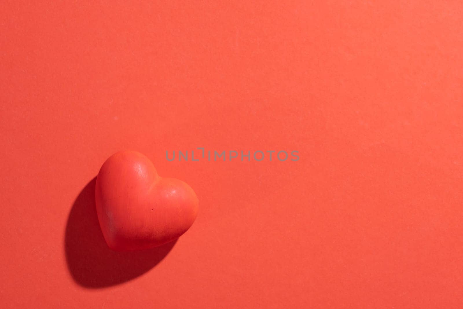 Valentines day. Red heart with copy space isolated on red background