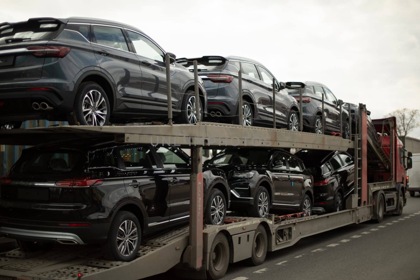 Original cars. Transporter with cars. Truck carries transport. Lots of cars.