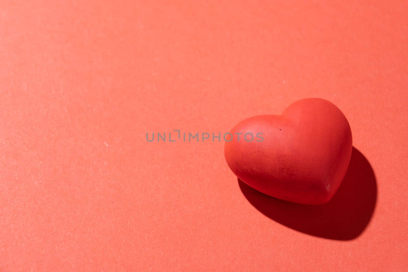 Valentines day. Red heart with copy space isolated on red background
