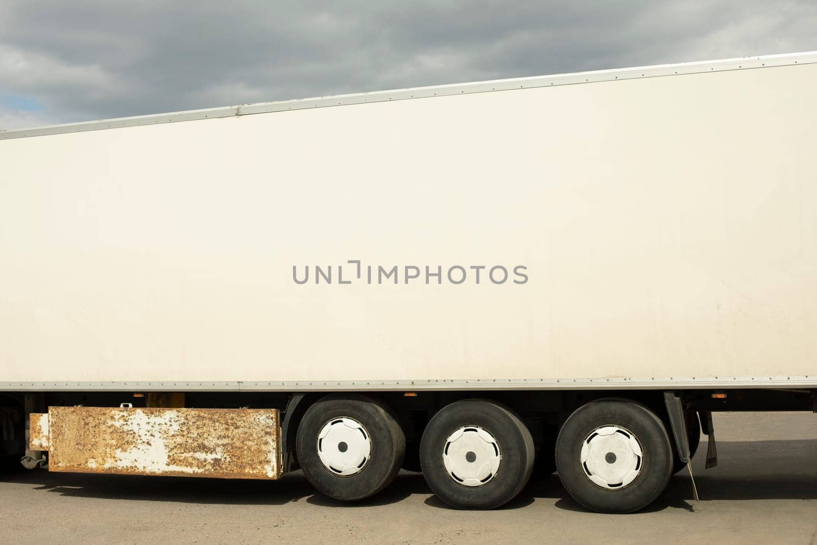 Truck trailer is white. Body of large truck. by OlegKopyov