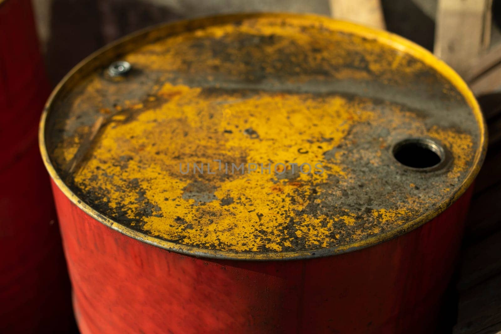 Fuel barrel with yellow lid. Red fuel tank. Old canister. Water tank.