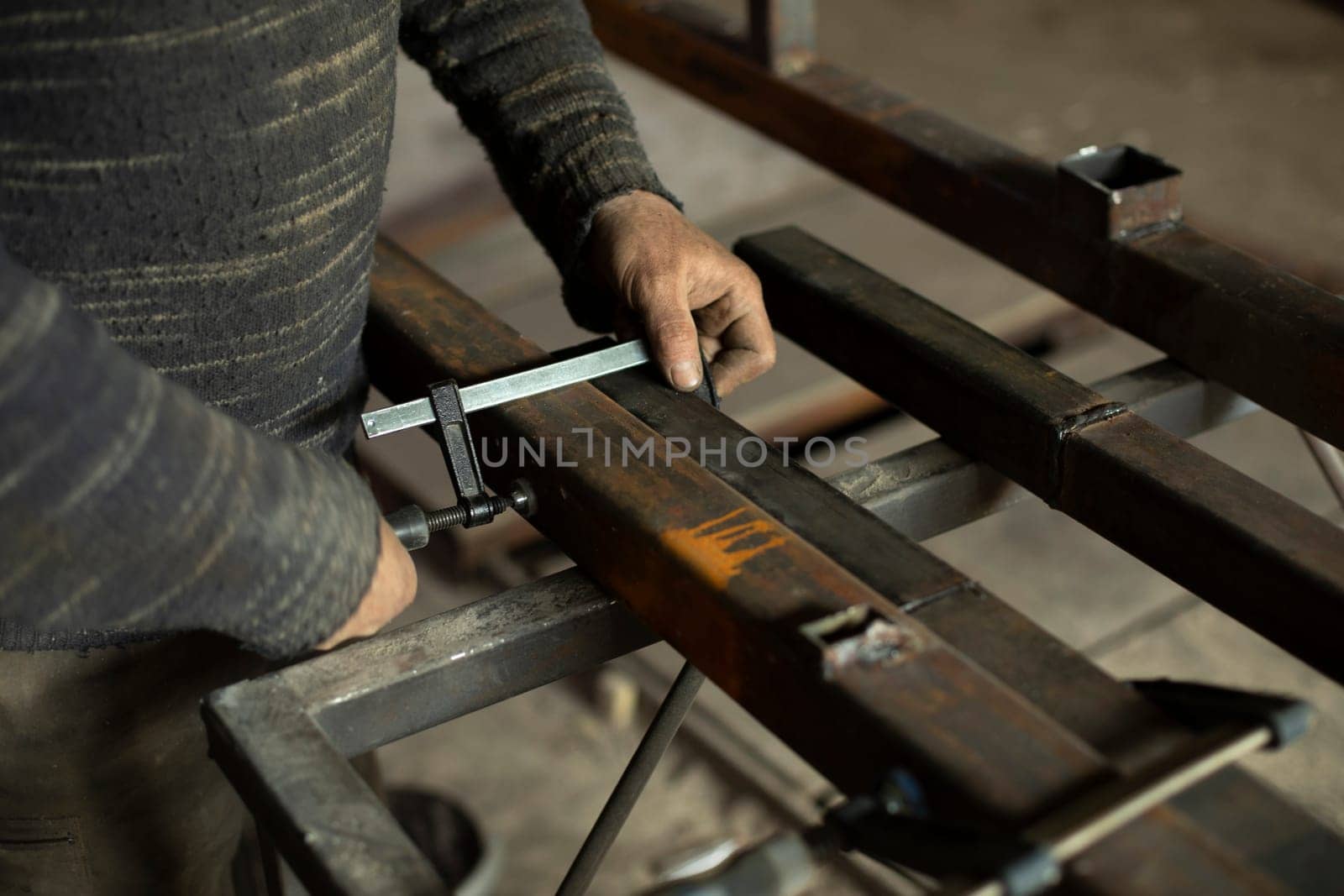 Metal processing in garage. Steel billet in garage. Fixed part.