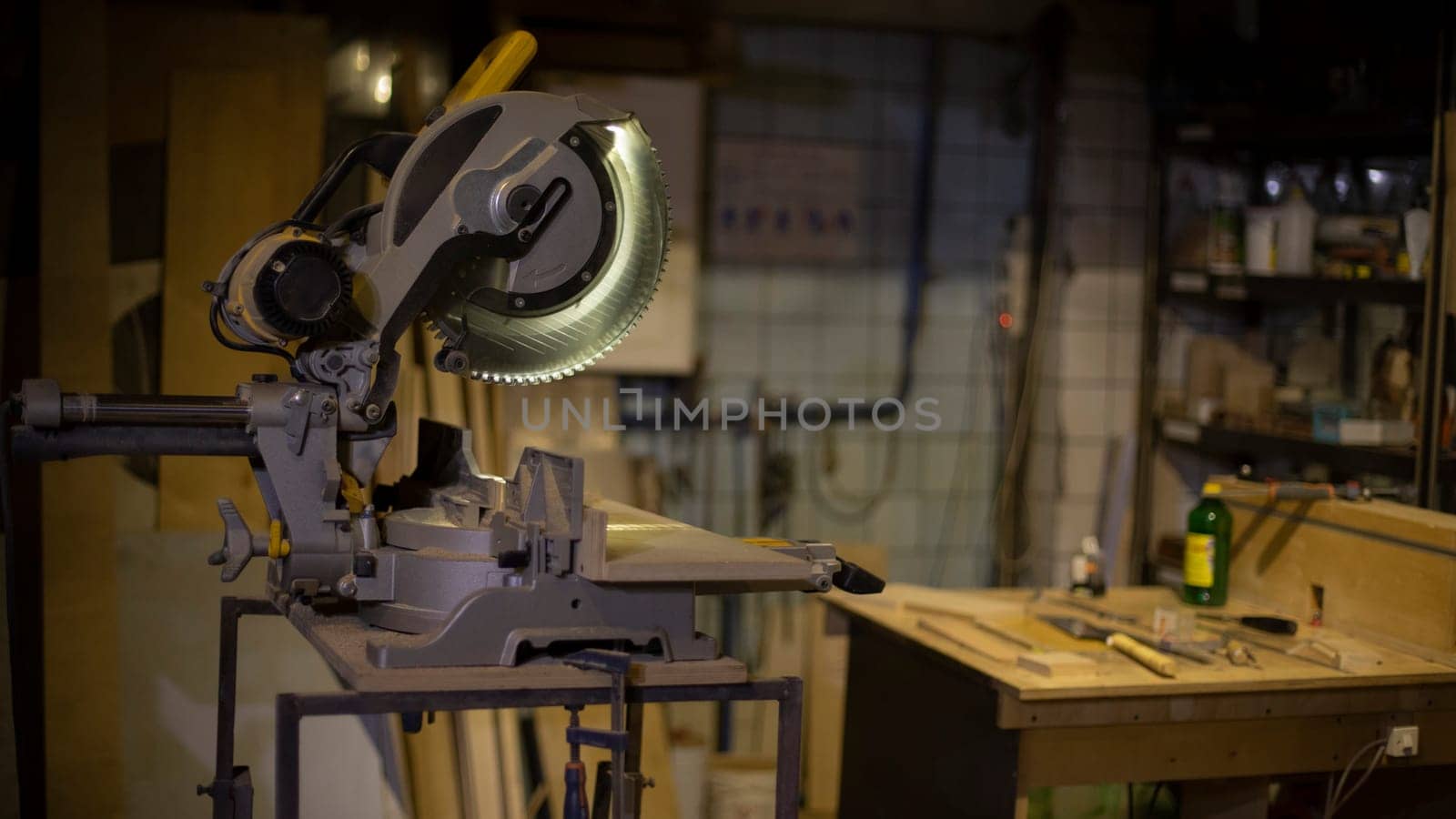 Items in garage. Workplace for creating structure. Production shop. Working tools on table.