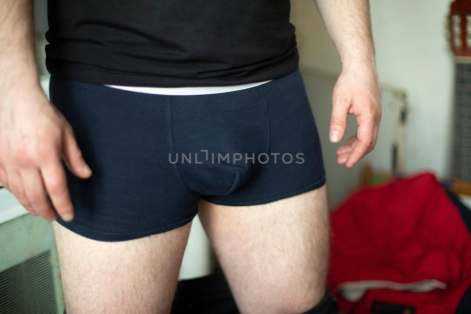 Guy in shorts. Blue men's underpants. Young man's underwear. Man pulled down his pants. by OlegKopyov