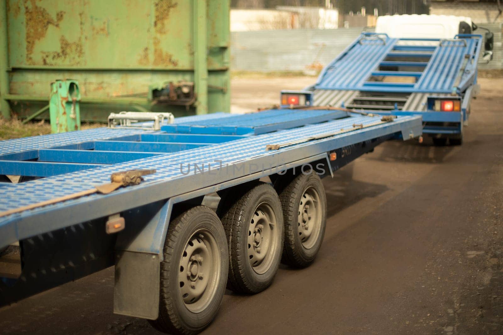 Pltatform for car towing. Freight transport. Blue trailer. by OlegKopyov