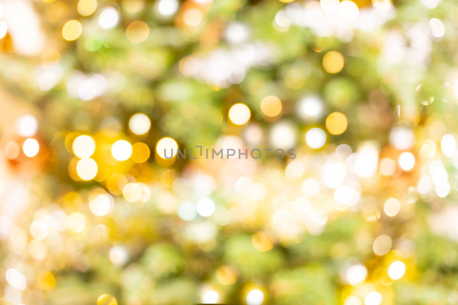 Gold Green Yellow Light Bokeh For Holiday Lights Background, Merry Christmas Or New Year Glowing Background. Abstract Glitter Defocused With Blinking Sparks. Festive Blurred Bokeh. Horizontal Plane by netatsi