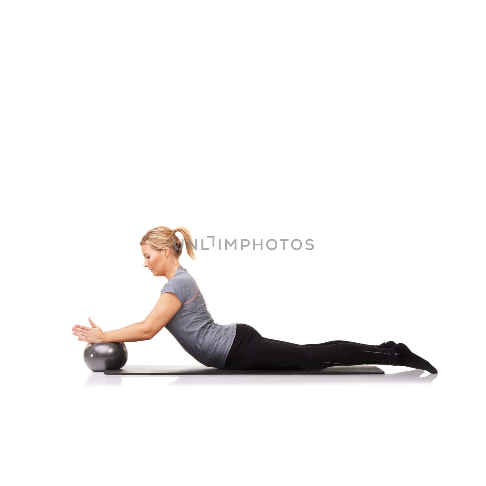 Woman, ball and arm balance on yoga mat for stretching back, pilates performance or white background. Female person, gym equipment and fitness in studio for mockup space, challenge or flexibility.
