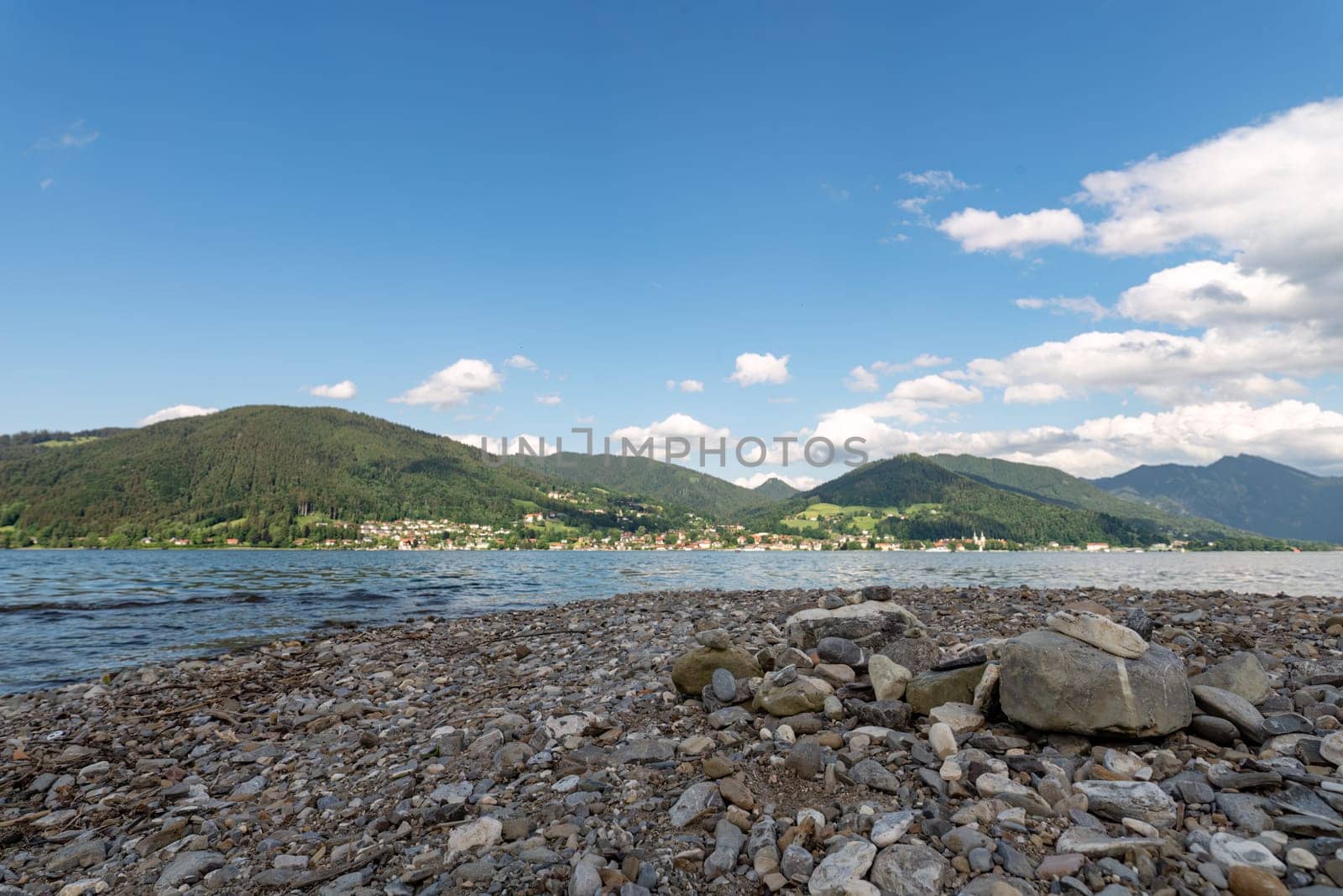 Pebbled Shoreline of Tegernsee with Alpine View, Bavaria.