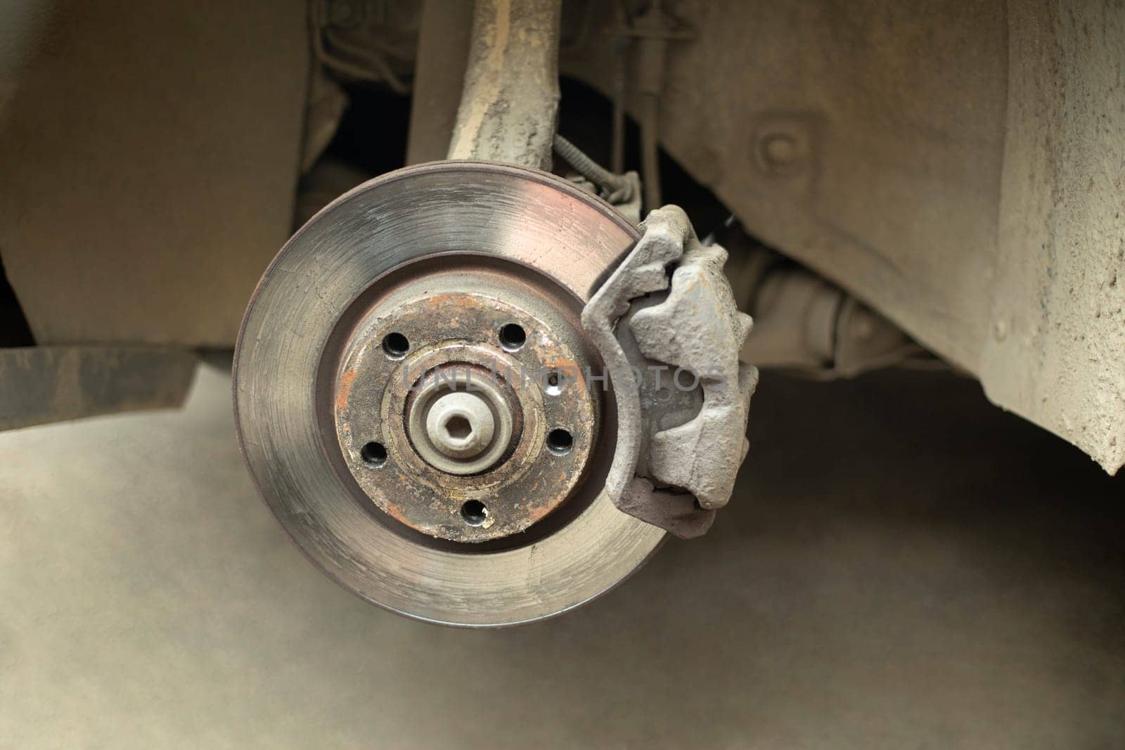 Wheel disk of car. Replacement of wheel in transport. Machine parts. Steel disc.