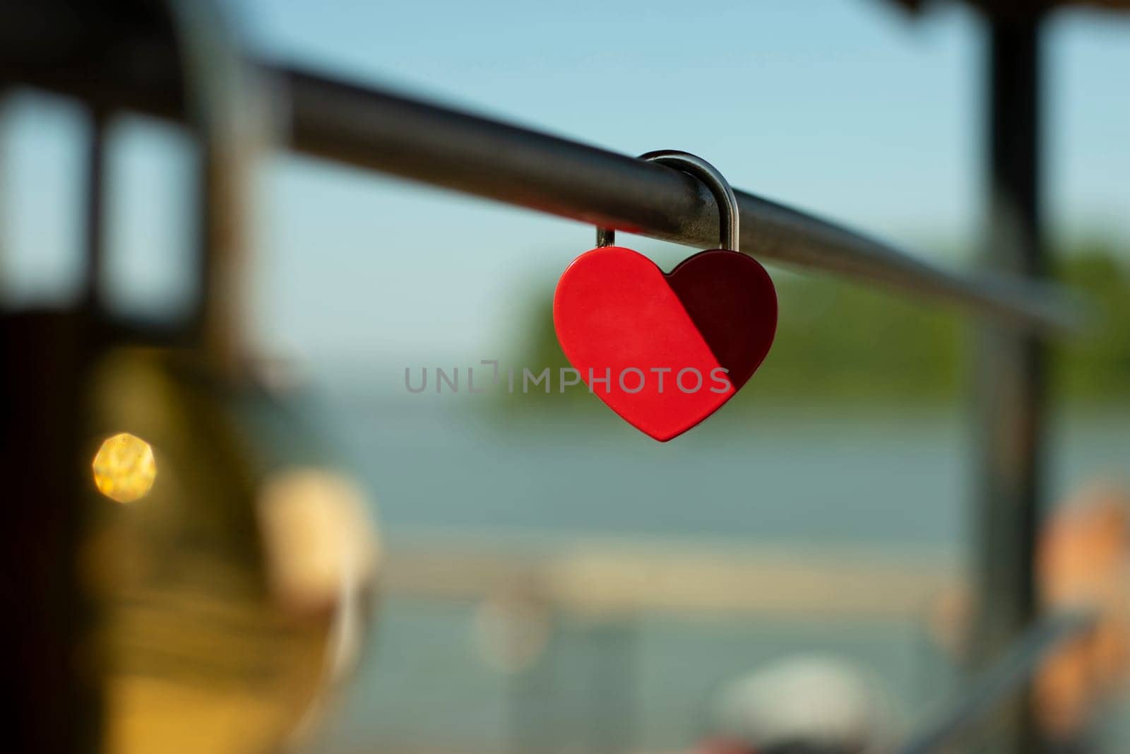 Heart lock is fixed to handrail. Wedding symbol. Wedding details. by OlegKopyov