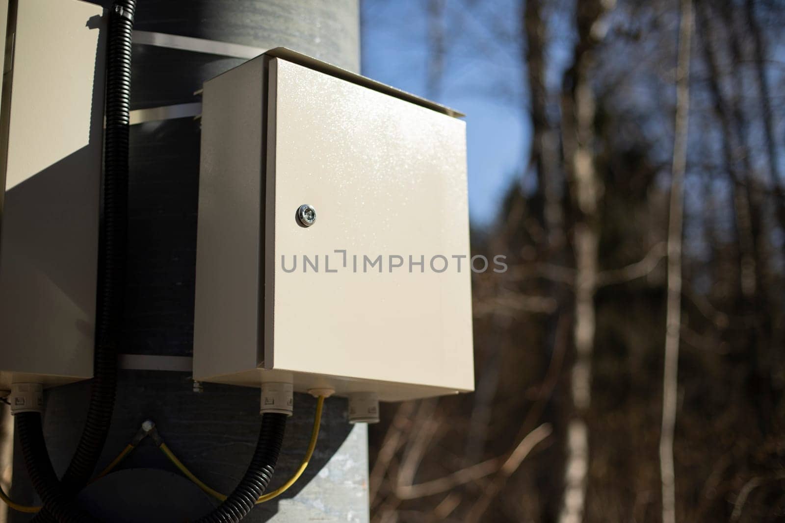 Box of wires. Electrical equipment on pole. Electricity switch.