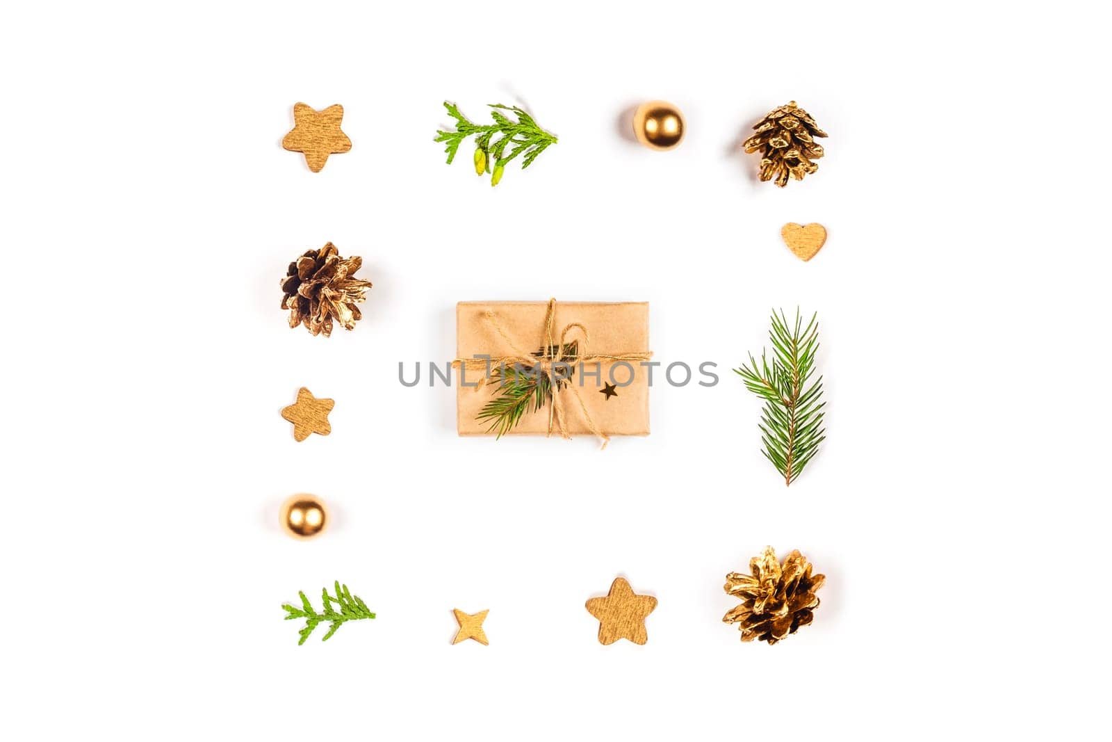 Christmas and New Year's gift surrounded by natural decor on a white isolated background.