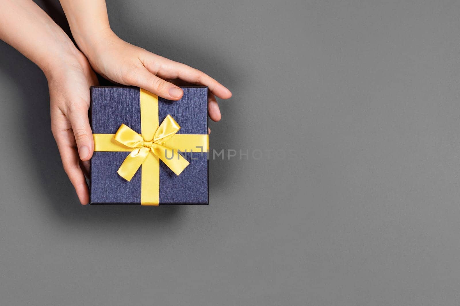 Hands with a gift box. by AlexAbramova