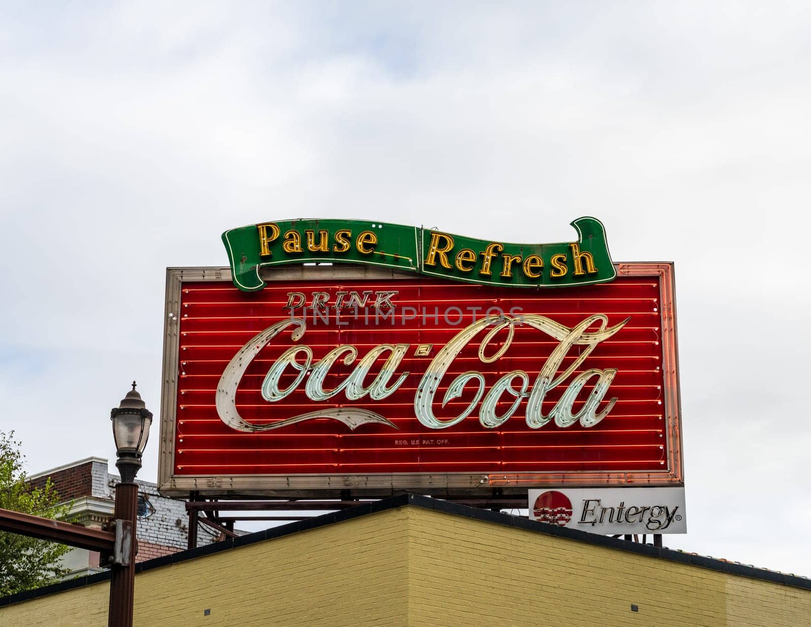 Baton Rouge, LA - 27 October 2023: Original design of historic retro Coca Cola sign on rooftop in the state capital of Louisiana